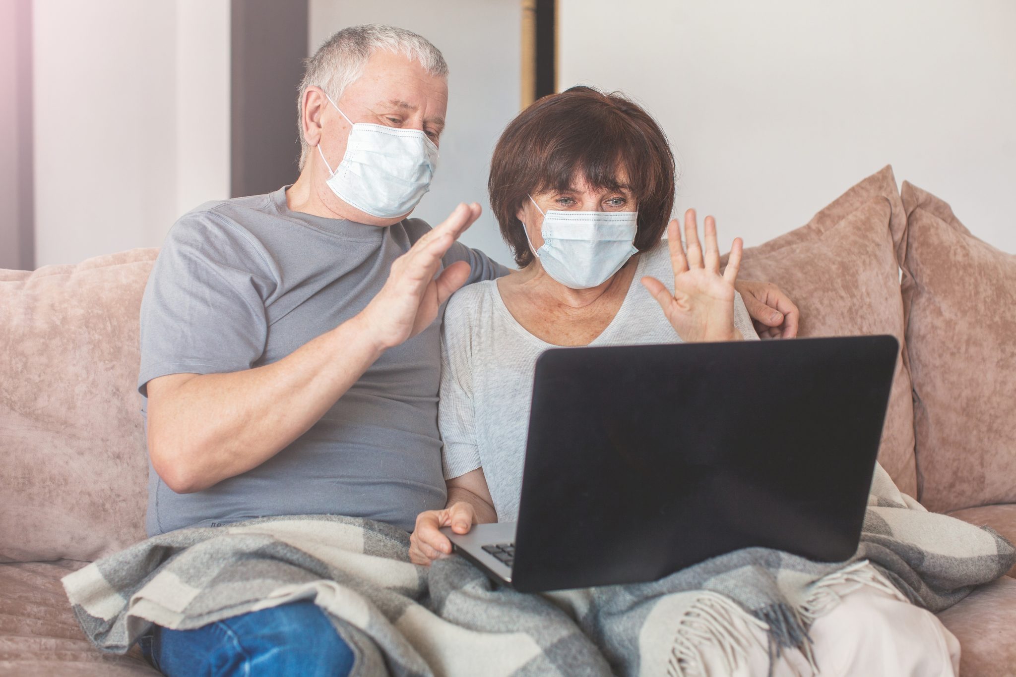 elderly couple wearing masks at home, digital qualitative research during covid